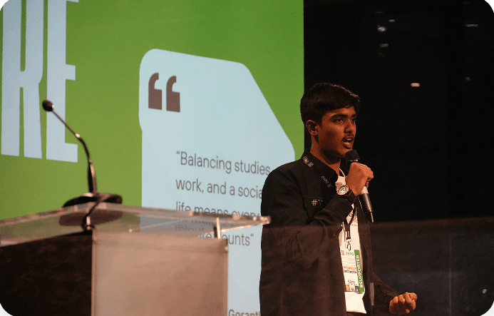 Student presenting on stage